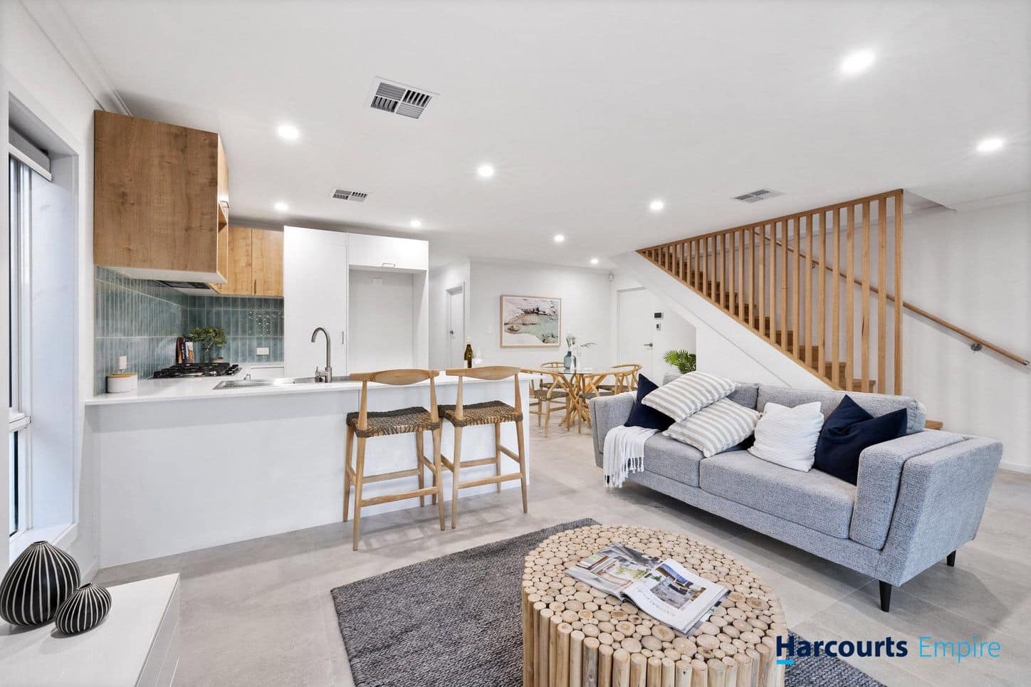 Hamptons Coastal style home with wraparound verandah and white weatherboard cladding