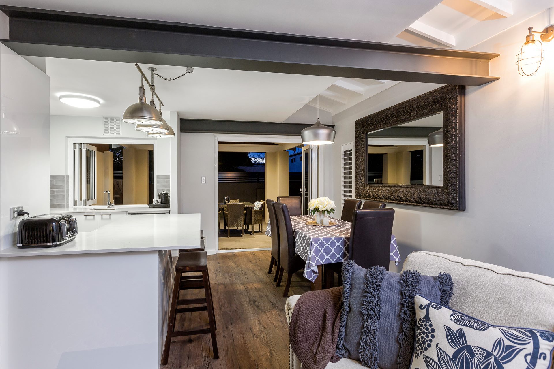 Modern townhouse makeover with dark cladding, feature entry, and manicured garden